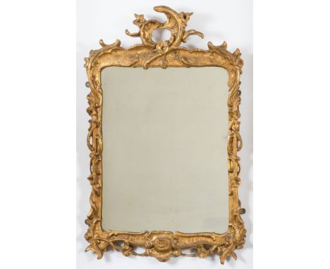 A 19th Century carved giltwood and gesso cartouche shaped mirror:, the plate within a surround of scrolling acanthus leaves a