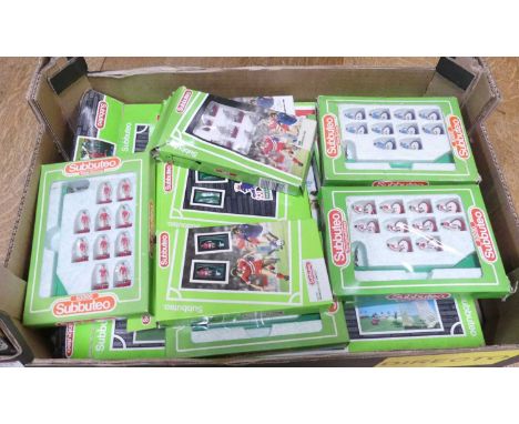 A quantity of Subbuteo table top miniatures from the 1980s and onwards to include Manchester United and various other pitch s