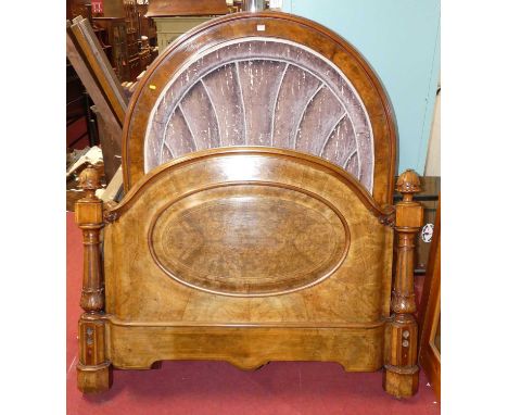 A mid-Victorian figured walnut double bedstead, the ornate arched frame having plush fabric upholstered inset headboard and p