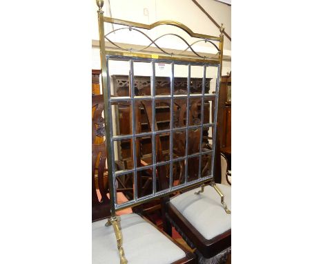 An Edwardian brass and lead glass inset fire screen, width 51cm