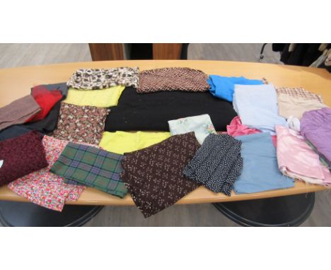 A box containing early to mid 20th Century fabrics including silks, crepes and cotton print florals 