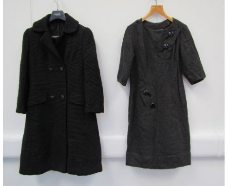 A 1960's black textured/ribbed double breasted coat, two flap front pockets, half back belt detail and a charcoal wool tailor