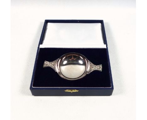 Scottish silver Quaich with "Celtic Knot" design handles, by F H, Edinburgh, 2003, W.12cm, 73grs, cased. (2)Condition Report: