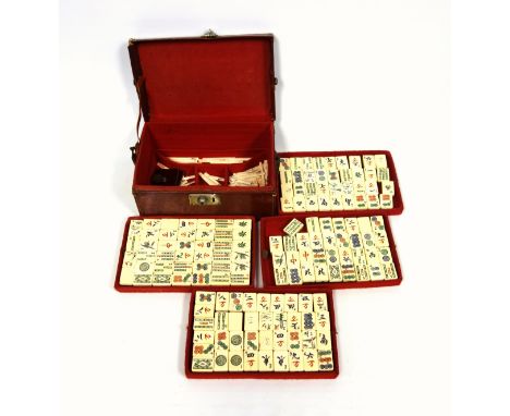 Chinese Mahjong set with bone and bamboo tiles and counters, in a felt lined leather case, W.24.5cm 