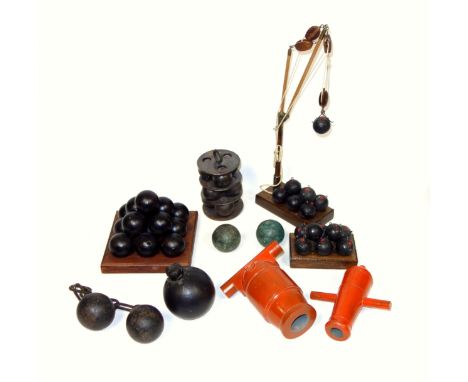 Model of a wood ship's crane on a mahogany finish base, with 8 mines, (1 a/f), H.39cm; 8 other mines on a wood base, 14 canno