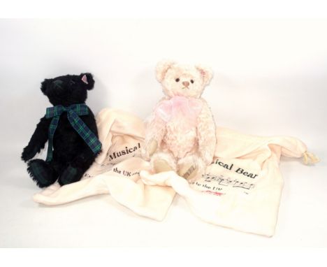 Steiff, two musical bears; one black model 662386 and one pink model 661624, each 30cm and each with soft bag. (2) 