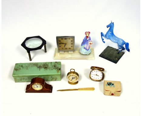 Art Deco Chromium table clock with a square dial on a rectangular onyx base mounted with a Doulton lady, W.22.9cm; State Expr