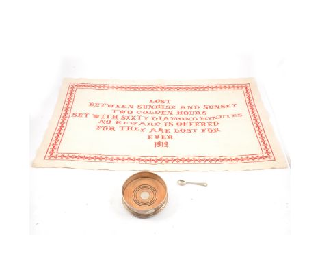 Modern silver coaster, by HB &amp; S, London, date mark worn, 13cm, and a sampler, 1912.
