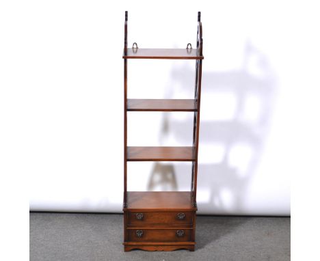 Reproduction Chippendale style mahogany shelves, three heights, lower section with two drawers, height 112cm, width 36cm, dep