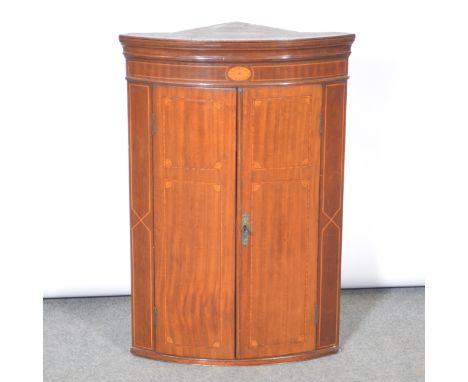 George III inlaid mahogany hanging corner cupboard, moulded cornice, two doors enclosing a shelf, width 59cm, depth 38cm, hei