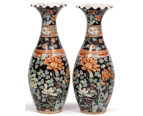 A PAIR OF JAPANESE BLACK GROUND TALL CERAMIC VASES of baluster form with polychrome foliate decoration and Greek key border 9