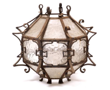 AN EARLY 20TH CENTURY WROUGHT IRON HANGING LANTERN with glazed panels 60cm wide x 53cm high overall