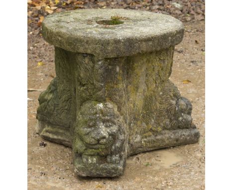 A COMPOSITE STONE STAND  of tripod form decorated with animal masks with circular top, 47cm x 37cm