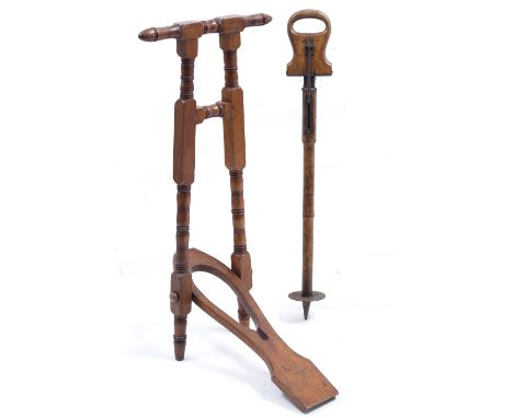 AN EDWARDIAN HARDWOOD BOOT JACK 40cm wide x 84cm high together with an Edwardian folding shooting stick (2)