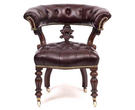 A WILLIAM IV MAHOGANY HORSESHOE TUB CHAIR with later red leather button upholstery, turned reeded legs and brass and ceramic 