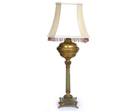 AN ONYX TABLE LAMP  with gilt metal mounts, the lamp with classical column support on a stepped base, possibly originally con