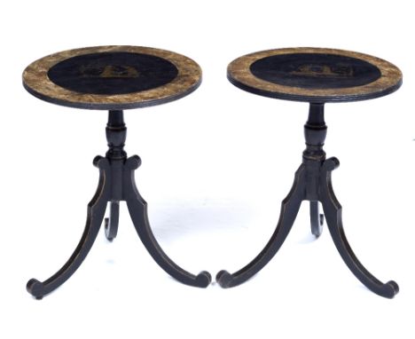 A PAIR OF EBONISED AND PARCEL GILT LOW OCCASIONAL TABLES the circular tops with painted decoration of figures, all on scrolli