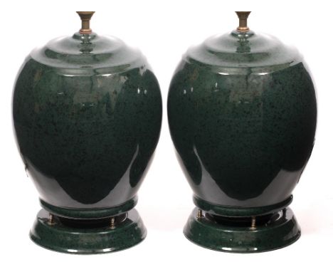 A PAIR OF LATE 20TH CENTURY / EARLY 21ST CENTURY GREEN PAINTED CERAMIC LAMPS with integrated speakers (purchased from Harrods