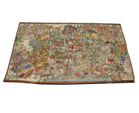 AN INDIAN NEEDLEWORK RECTANGULAR TAPESTRY PANEL with polychrome decoration of birds and animals in a jungle setting