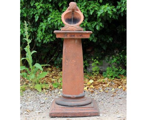 A GEORGE V TERRACOTTA SUN DIAL possibly by The Compton Pottery, the sun dial with cherub support above a square capital with 