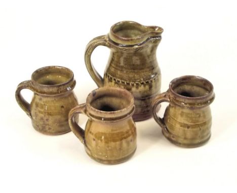 MIKE DODD. A pint jug &amp; three mugs by Mike Dodd. Personal marks.