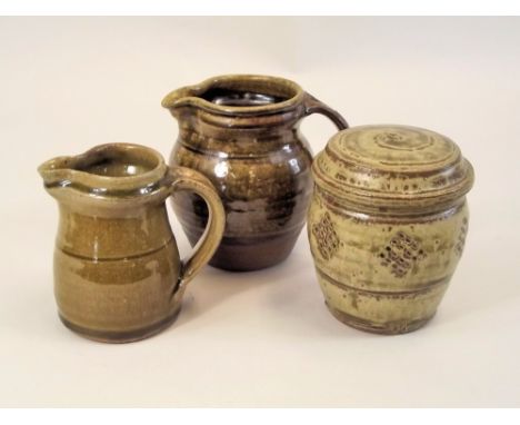 MIKE DODD. A lidded jar &amp; two jugs by Mike Dodd. Personal marks. Jar height 12.5cm.