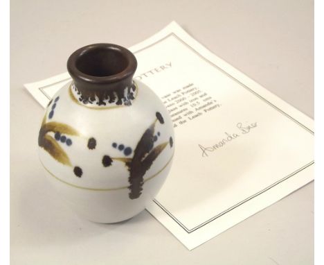 AMANDA BRIER. A porcelain vase by Amanda Brier. Personal mark &amp; Leach Pottery mark. Signed certificate. Height 10.5cm.