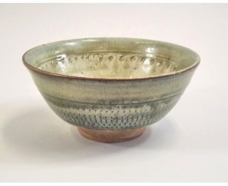 RICHARD BATTERHAM. A deep, footed bowl decorated with chattering by Richard Batterham. Diameter 21.5cm.