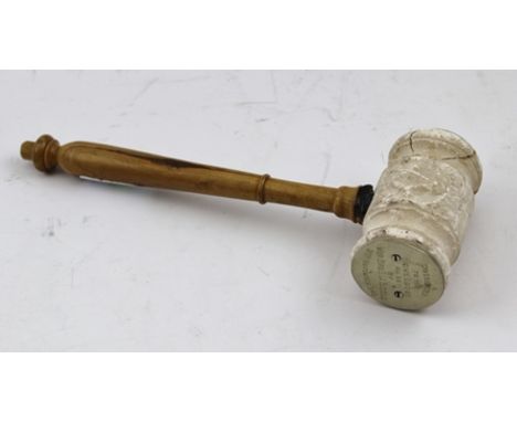 A MASONIC GAVEL with stone head and olive wood handle, engraved inscription "Presented to the Howe Lodge No. 587 by Wor. Bro.