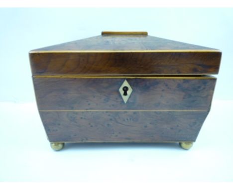 A 19TH CENTURY YEW WOOD TEA CADDY, the hinged cover opens to reveal two lidded compartments, string inlaid, decorative brass 