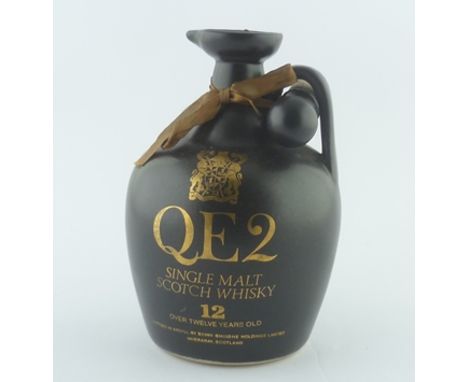 QE2 SINGLE MALT SCOTCH WHISKY aged 12 years, 48.6% vol., 75cl in ceramic flask with stopper 