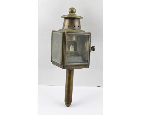 A BRASS CARRIAGE LAMP, the "Dependence" manufactured in Birmingham, also bears a "Brown Bros, London" label, fitted two bevel