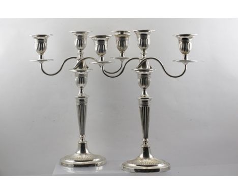 FORDHAM & FAULKNER (William Fordham and Albert Faulkner) A PAIR OF EDWARDIAN SILVER TABLE CANDELABRA of Adam design, comprisi