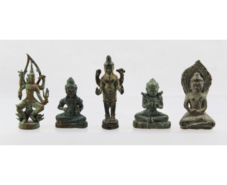 A COLLECTION OF FIVE 19TH CENTURY BRONZE FAR EASTERN DEITIES, includes seated Buddhas and depictions of Krishna, tallest 7.5c