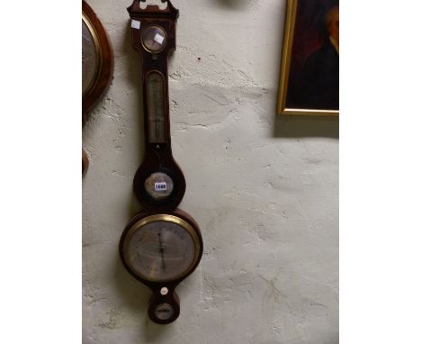 A MAHOGANY WHEEL BAROMETER, THE BROKEN PEDIMENT ABOVE DRY/DAMP DIAL, MERCURY THERMOMETER, CONVEX MIRROR THE SILVERED DIAL, AD