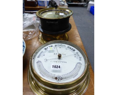 AN ELLIOTT BRASS CASED SHIPS TIMEPIECE ANOTHER BY GENERAL ELECTRIC TOGETHER WITH A SEWILL BRASS CASED SHIPS ANEROID BAROMETER
