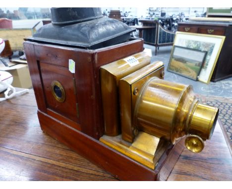 A MAHOGANY MAGIC LANTERN WITH LACQUERED BRASS LENS MOUNTS.   W 41cms.