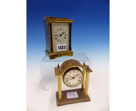 A GLAZED BRASS CASED CARRIAGE TIME PIECE, THE BACK PLATE STAMPED A C G IN AN OVAL.   H 12.5cms. TOGETHER WITH A SWIZA ALARM C