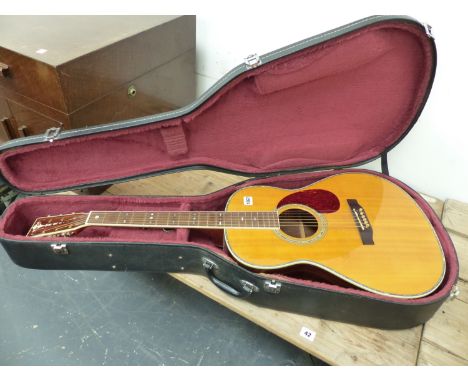 A COPY OF A GIBSON ACCOUSTIC GUITAR, No 38090 WITH A CARRYING CASE. NOTE THIS GUITAR IS A RE-BADGED CRAFTER.