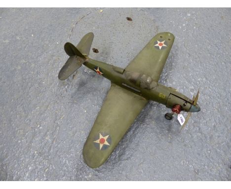 AN AMERICAN WORLD WAR II MODEL WAR PLANE, THE THREE BLADED PROP POWERED BY A LIVE FUEL ENGINE, THE WINGSPAN.   W 69cms.