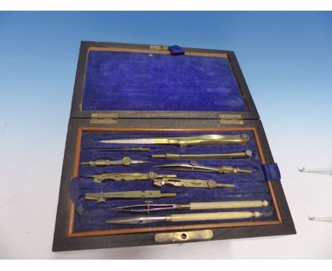 A ROSEWOOD CASED GEOMETRY SET THE INTERIOR WITH FITTED TRAY AND WITH THREE PROTRACTORS WITHIN THE LID, THE BOX.   W 21.5cms.