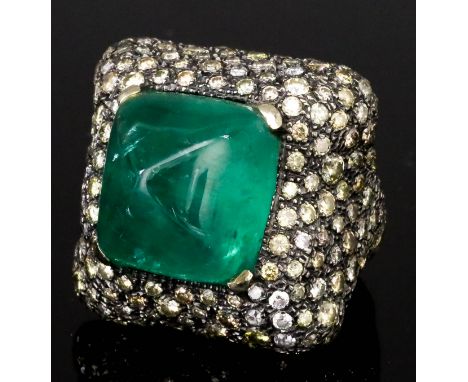 An Emerald and Diamond Ring, Modern, by Hedy Martinelli, in titanium mount, set with a central conical emerald, approximate w