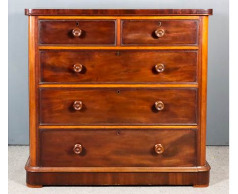 A Victorian Mahogany Chest, with rounded front corners and square edge to top, fitted two short and three long drawers, on pl