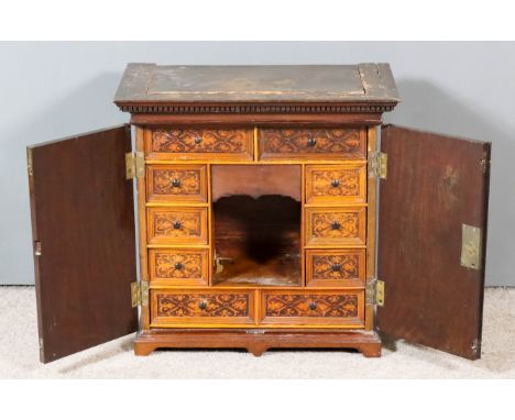 A 19th Century Mahogany Table Cabinet, with moulded and dentil cornice, the cedar wood fitted interior with penwork drawer fr