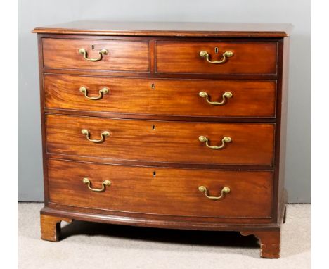 A George III Mahogany Bow Front Chest, with moulded edge to top, fitted two short and three long graduated drawers with brass