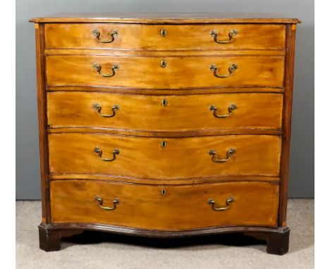 A George III Mahogany Serpentine Fronted Secretaire Chest, with moulded edge to top, the drawer fronts inlaid with rosewood b
