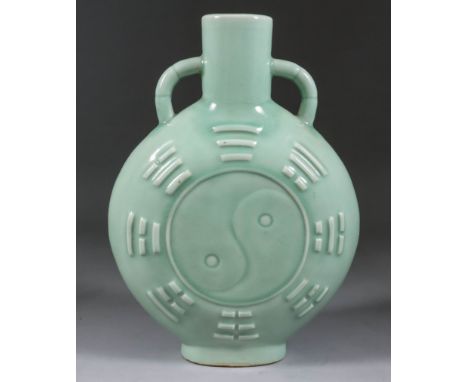 A Chinese Green Celadon Glazed Stoneware Two-Handled "Pilgrim's Flask", 20th Century, the circular flattened body with moulde