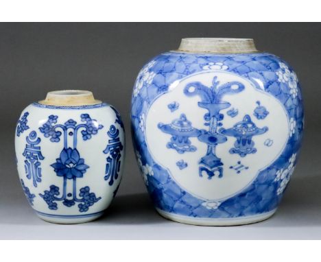 A Chinese Porcelain Blue and White Jar, Kangxi, painted alternately with stylised flowers and symbols, 5ins (12.7cm) high, an