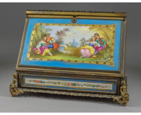 A French Gilt Brass Framed and Porcelain Mounted Stationery Box, Late 19th Century, the porcelain panel to fall front enamell