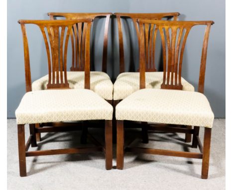 A Set of Four Mahogany Dining Chairs of "Country Chippendale" Design, the crest rails with scroll ends, fretted vase pattern 